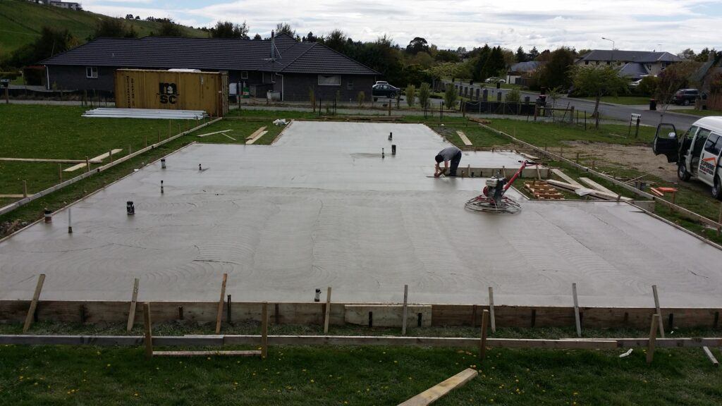 Luke Moretti concreting a house floor