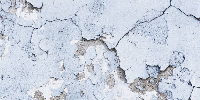 Concrete cracks, frst damage and causes flaky surface.